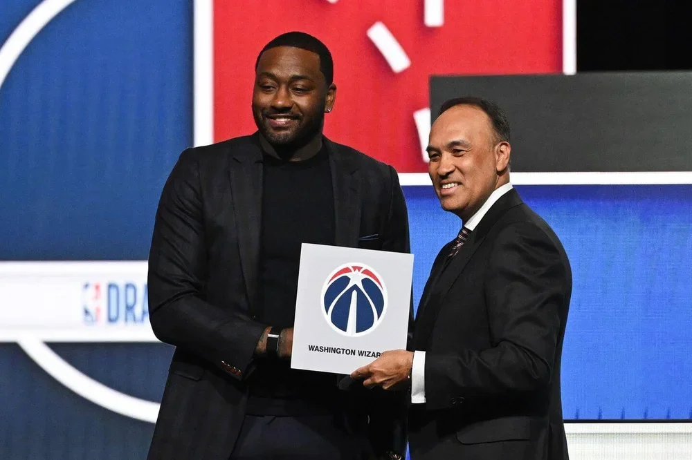 Former Wizards player John Wall with NBA Deputy Commissioner Mark Tatum after Washington landed the top pick